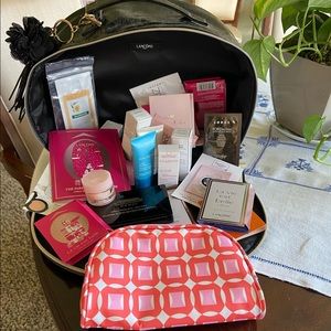 Lancôme cosmetic travel case with cosmetic samples and compact cosmetic case.